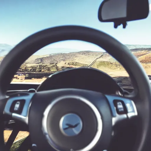 KREA muscular arm gripping a steering wheel at the top, first person